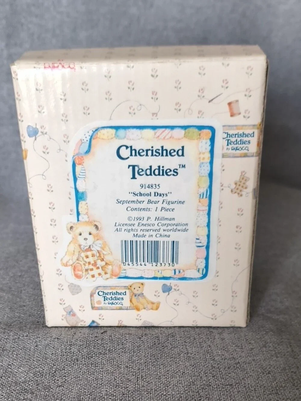 Cherished Teddies tan bear figurine with pastel blue and pink accents